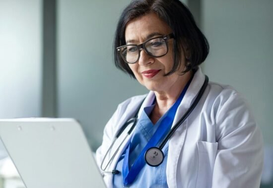 Doctor reading off a clipboard