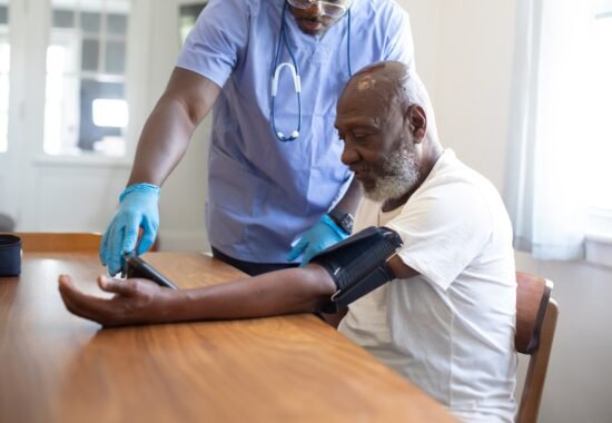 Doctor checking patients blood pressure