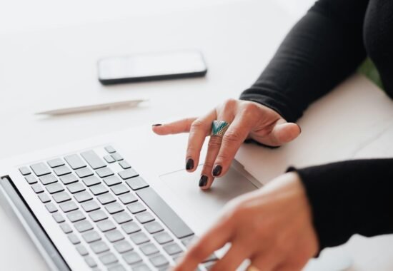 Person typing on keyboard